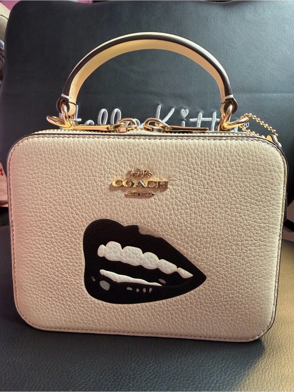 Coach Cream Leather Top-Handle Satchel with Black Lip Graphic